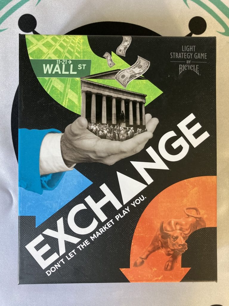 Exchange board game box featuring a grayscale hand holding a government building with dollar bills floating around it.