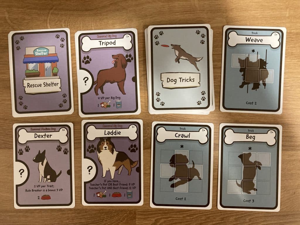 Dog Lover board game by AEG Rescue Shelter cards and Tricks cards.